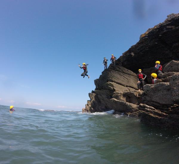 Children jumping in to the sea from the rocks