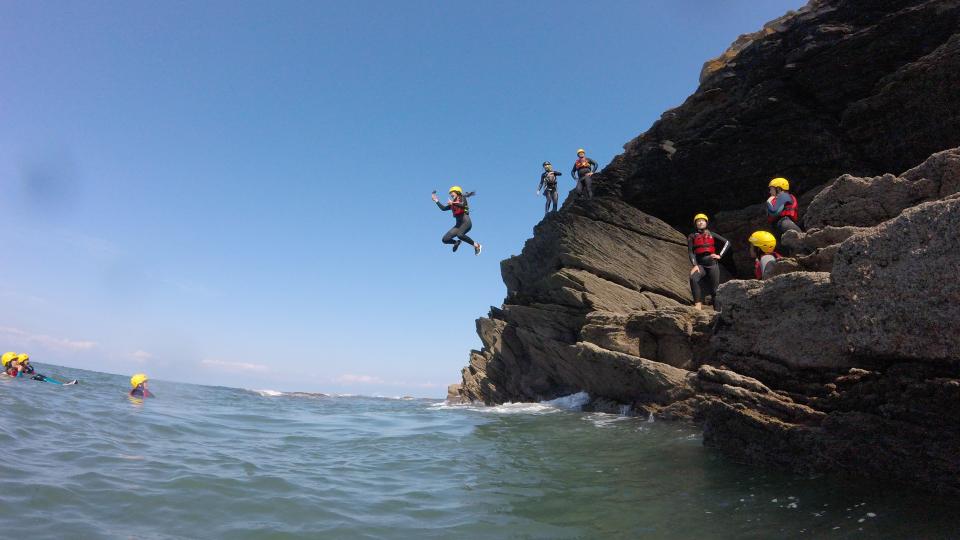 jumping off rock in to the sea